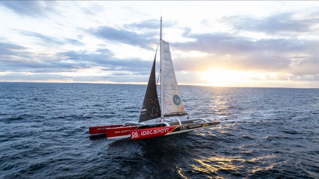 The Ultim IDEC SPORT-CIC at sea at sunset